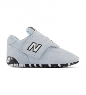 New Balance para niños. Zapatillas de piel 574 Backyard Friends gris a