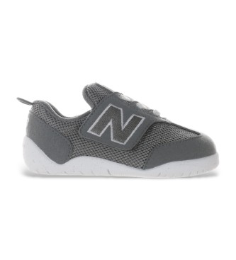 New Balance unisex para niños. NW1STV1 Zapatillas de piel New-B First gris (18.5 W), Plano, Velcro, Casual, moda infantil