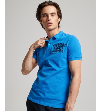 Superdry - pour homme. polo bleu superstate